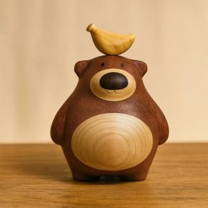 Hand-Carved Wooden Bear with Banana: Natural Wood Sculpture